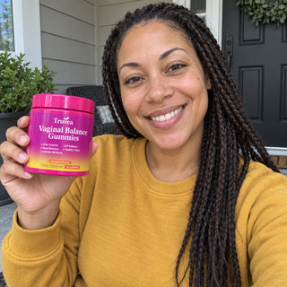 Customer holding Truvea gummies