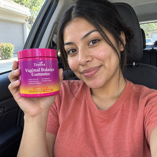 Customer holding Truvea gummies