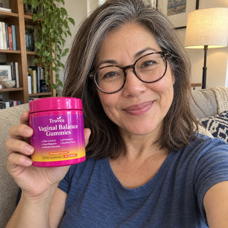 Customer holding Truvea gummies